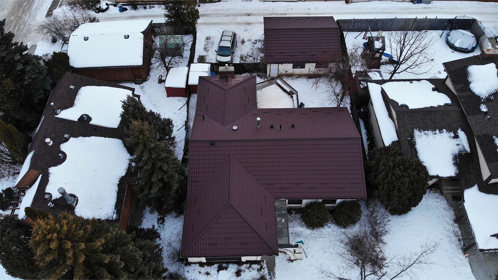 A home with metal roofing designed to last winters in Alberta